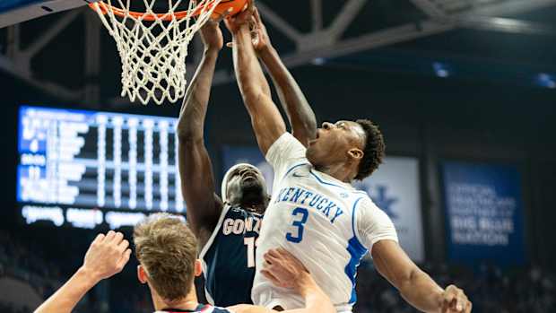 Kentucky Wildcats guard Adou Thiero (3) goes for a layup against Gonzaga Bulldogs defenders during their game on Saturday, Feb. 10, 2024 at Rupp Arena.