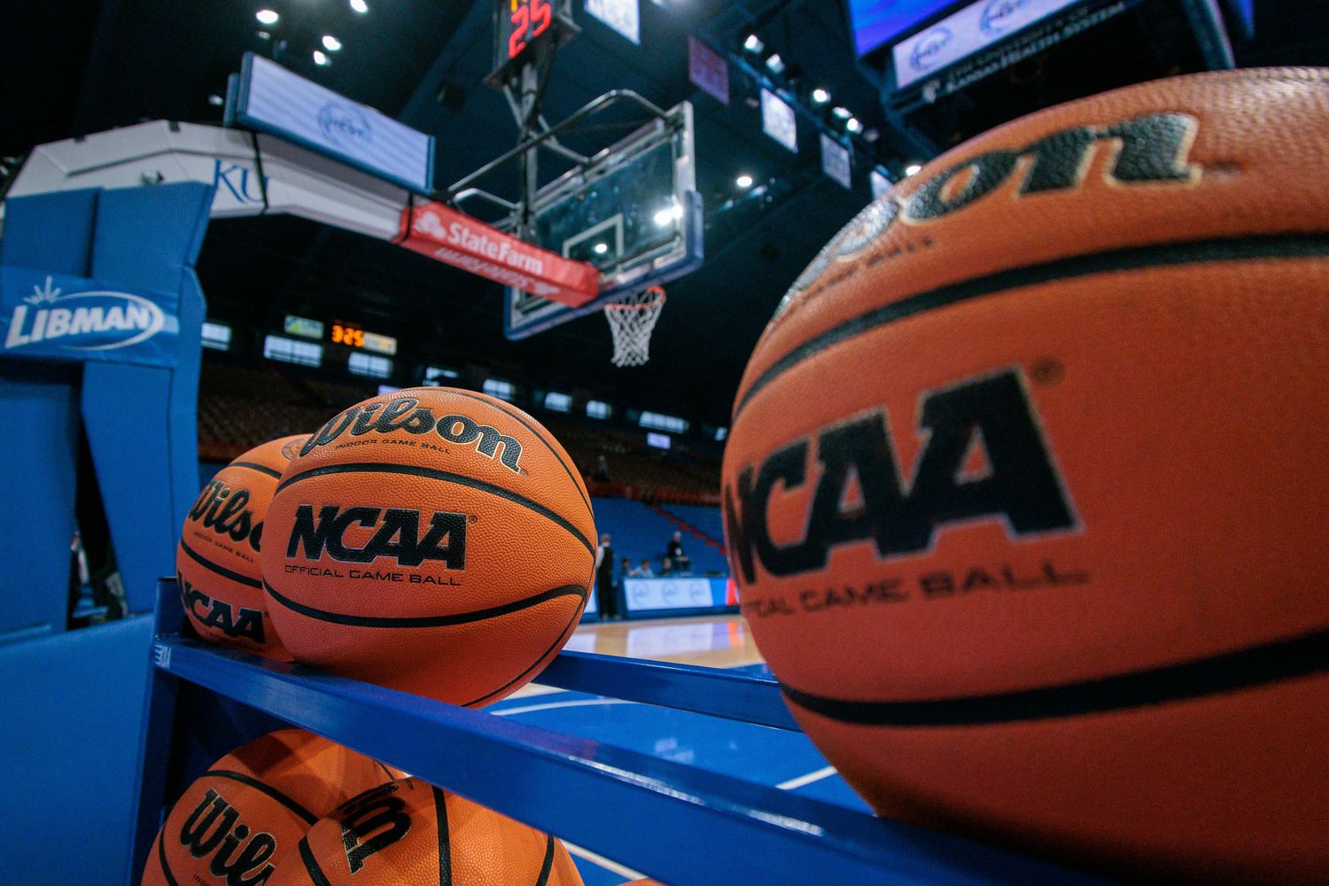 Feb 10, 2024; Lawrence, Kansas, USA; Practice basketballs sit court side prior to a game between the Kansas Jayhawks and the Baylor Bears at Allen Fieldhouse. Mandatory Credit: William Purnell-USA TODAY Sports  