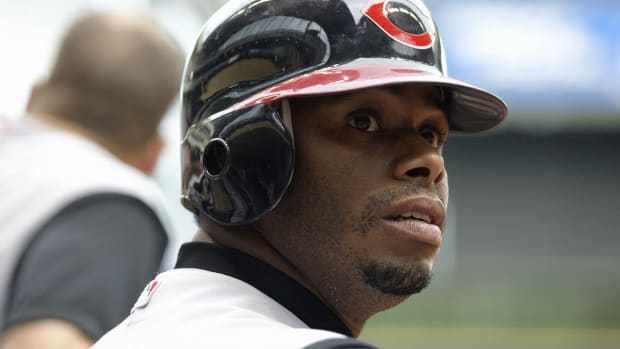 August 13, 2005; Milwaukee, WI, USA; Ken Griffey Jr. #30 of the Cincinnati Reds waits at the edge of the dugout during the first inning of the game against the Milwaukee Brewers at Miller Park. Mandatory Credit: Photo By Jeff Hanisch-USA TODAY Sports Copyright (c) 2005 Jeff Hanisch  