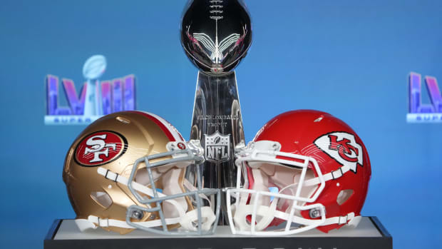 Feb 5, 2024; Las Vegas, NV, USA; Helmets for the San Francisco 49ers and Kansas City Chiefs on display with the Vince Lombardi Trophy before NFL commissioner Roger Goodell speaks at a press conference in advance of Super Bowl LVIII between the Kansas City Chiefs and San Francisco 49ers at Allegiant Stadium.