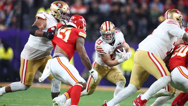 Christian McCaffrey runs with the ball