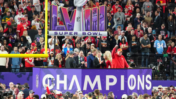 Feb 11, 2024; Paradise, Nevada, USA; Kansas City Chiefs head coach Andy Reid celebrates on the podium after defeating the Kansas City Chiefs in Super Bowl LVIII at Allegiant Stadium.