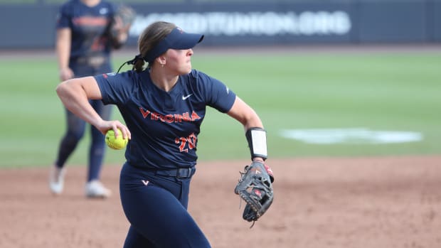 Shelby Barbee throws to first base during the Virginia softball game against Louisville at Palmer Park.