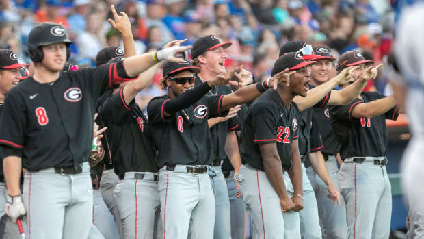 Georgia's dugout celebrates first baseman Charlie Condon's (24) home run on the Gators, Friday, April 14, 2023, at Condron Family Baseball Park in Gainesville, Florida. The Gators lost Game 1 of the weekend series to the Bulldogs 13-11. 2023 Gator Baseball April 14, 2023 Condron Family Ballpark Georgia Bulldogs. (Cyndi Chambers / USA TODAY NETWORK).