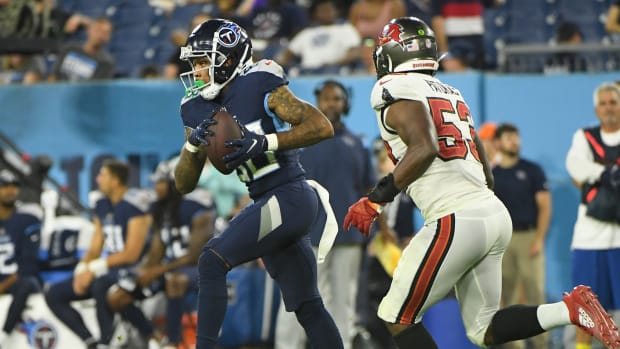 Aug 20, 2022; Nashville, Tennessee, USA; Tennessee Titans wide receiver Terry Godwin (80) makes a catch as Tampa Bay Buccaneers linebacker Olakunle Fatukasi (53) chases during the second half during the second half at Nissan Stadium. Mandatory Credit: Steve Roberts-USA TODAY Sports  