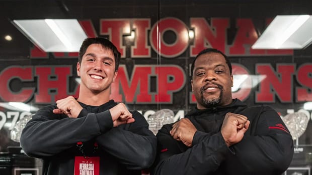 Ashton Murphy and Nebraska defensive line coach Terrance Knighton