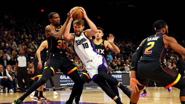 Jan 16, 2024; Phoenix, Arizona, USA; Sacramento Kings forward Domantas Sabonis (10) drives to the basket against Phoenix Suns forward Kevin Durant (35) during the fourth quarter at Footprint Center. Mandatory Credit: Mark J. Rebilas-USA TODAY Sports  
