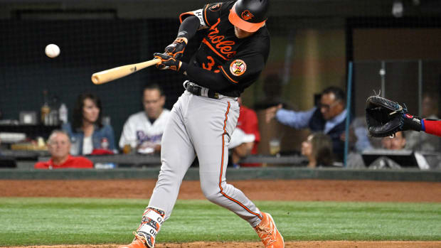 Oct 10, 2023; Arlington, Texas, USA; Baltimore Orioles first baseman Ryan O'Hearn (32) hits a single in the fourth inning against the Texas Rangers during game three of the ALDS for the 2023 MLB playoffs at Globe Life Field. Mandatory Credit: Jerome Miron-USA TODAY Sports