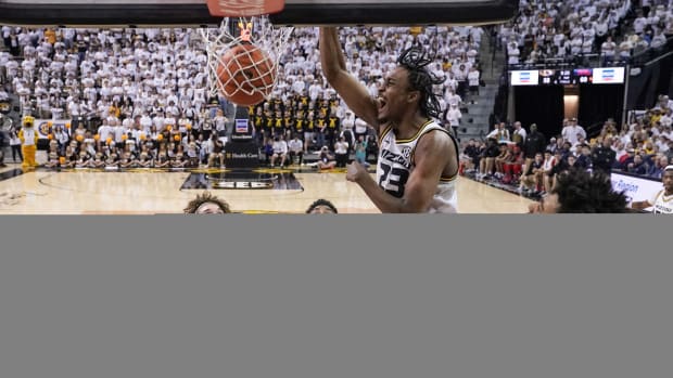 Mar 4, 2023; Columbia, Missouri, USA; Missouri Tigers forward Aidan Shaw (23) dunks the ball as Mississippi Rebels forward Jaemyn Brakefield (4) defends during the second half at Mizzou Arena. Mandatory Credit: Denny Medley-USA TODAY Sports