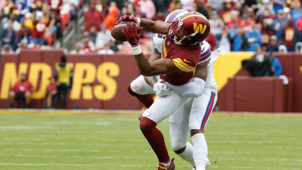 Sep 24, 2023; Landover, Maryland, USA; Washington Commanders cornerback Kendall Fuller (29) intercepts a pass intended for Buffalo Bills wide receiver Gabe Davis (13) at FedExField. Mandatory Credit: Geoff Burke-USA TODAY Sports