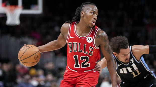 Chicago Bulls guard Ayo Dosunmu (12) is fouled by Atlanta Hawks guard Trae Young (11) during the second half at State Farm Arena.
