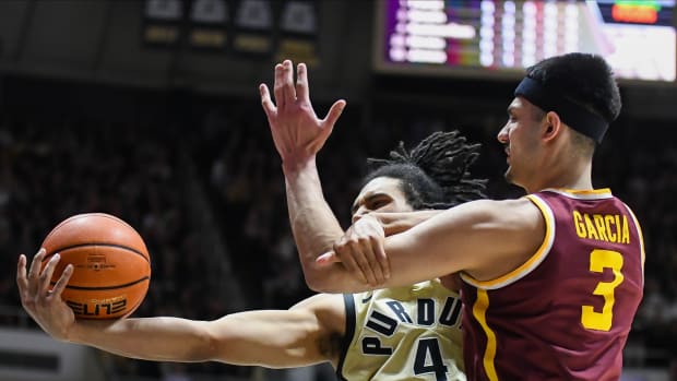 Purdue forward Trey Kaufman-Renn (4) rebounds the ball against Minnesota forward Dawson Garcia (3) during the first half at Mackey Arena in West Lafayette, Ind.