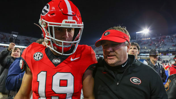 Nov 25, 2023; Atlanta, Georgia, USA; Georgia Bulldogs tight end Brock Bowers (19) and head coach Kirby Smart walk off the field after defeating the Georgia Tech Yellow Jackets at Bobby Dodd Stadium at Hyundai Field. Mandatory Credit: Brett Davis-USA TODAY Sports