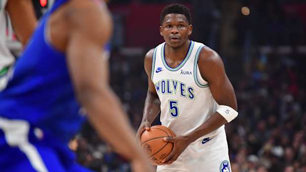 Feb 12, 2024; Los Angeles, California, USA; Minnesota Timberwolves guard Anthony Edwards (5) controls the ball against the Los Angeles Clippers during the first half at Crypto.com Arena.