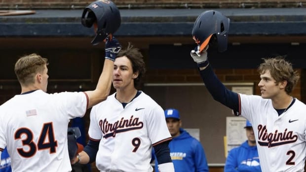 Harrison Didawick celebrates with Henry Ford and Henry Godbout after hitting a home run during the Virginia baseball game against Hofstra at Disharoon Park.