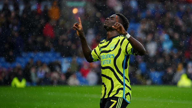 Bukayo Saka pictured celebrating after scoring two goals for Arsenal in a 5-0 win at Burnley in February 2024