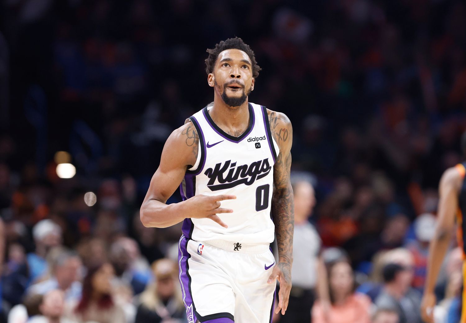 Feb 11, 2024; Oklahoma City, Oklahoma, USA; Sacramento Kings guard Malik Monk (0) gestures after scoring a three point basket against the Oklahoma City Thunder during the second half at Paycom Center. Mandatory Credit: Alonzo Adams-USA TODAY Sports  