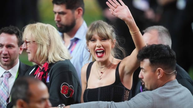 Feb 11, 2024; Paradise, Nevada, USA; Recording artist Taylor Swift enters the field as Kansas City Chiefs wins over the San Francisco 49ers in overtime of Super Bowl LVIII at Allegiant Stadium.
