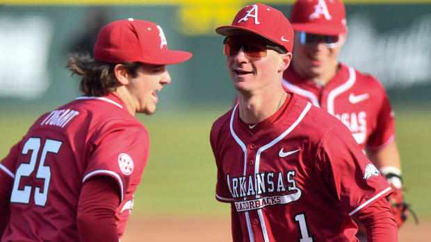 Razorbacks Ty Wilmsmeyer celebrates with Brady Tygart
