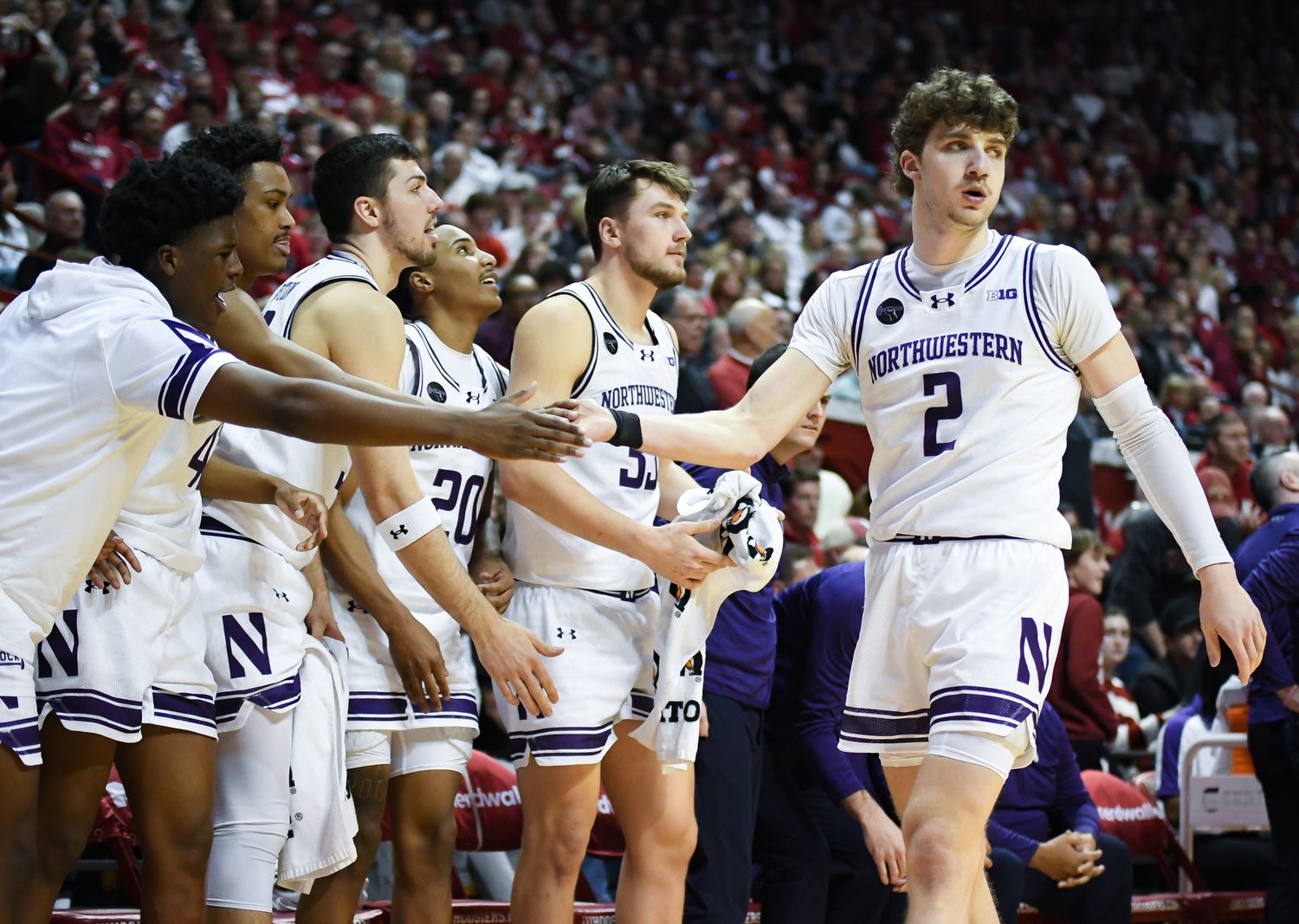 Northwestern Wildcats forward Nick Martinelli (2) celebrates with the bench after a play against the Indiana Hoosiers during the second half at Simon Skjodt Assembly Hall.