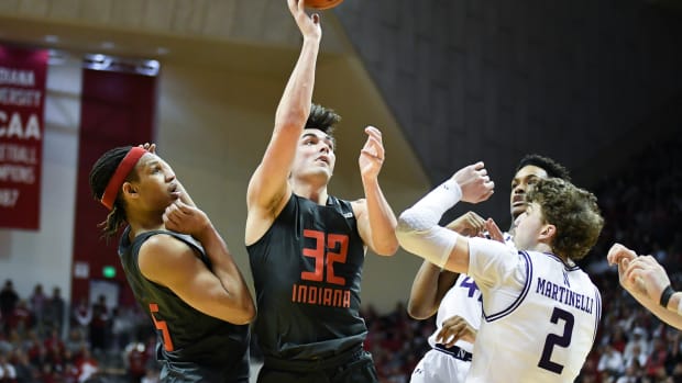 Indiana Hoosiers guard Trey Galloway (32) attempts a shot over Northwestern Wildcats forward Nick Martinelli (2).