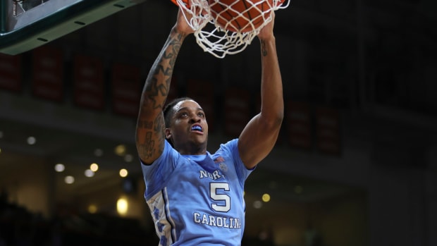 Feb 10, 2024; Coral Gables, Florida, USA; North Carolina Tar Heels forward Armando Bacot (5) dunks the basketball against the Miami Hurricanes during the first half at Watsco Center.