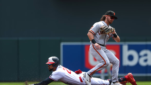 May 24, 2023; Minneapolis, Minnesota, USA; Minnesota Twins designated hitter Byron Buxton (25) steals second base as San Francisco Giants second baseman Brett Wisely (70) fields the ball in the first inning at Target Field.