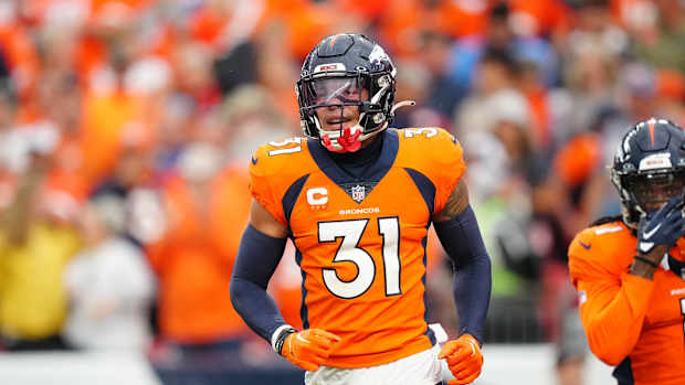 Sep 10, 2023; Denver, Colorado, USA; Denver Broncos safety Justin Simmons (31) reacts to a turnover in the third quarter against the Las Vegas Raiders at Empower Field at Mile High. Mandatory Credit: Ron Chenoy-USA TODAY Sports
