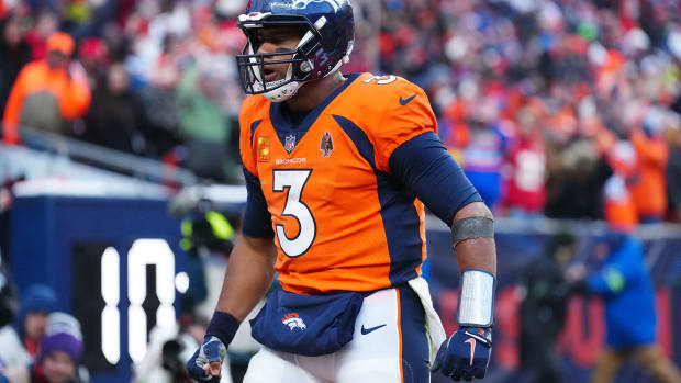 Oct 29, 2023; Denver, Colorado, USA; Denver Broncos quarterback Russell Wilson (3) celebrates a touchdown pass in the fourth quarter against the Kansas City Chiefs at Empower Field at Mile High. Mandatory Credit: Ron Chenoy-USA TODAY Sports