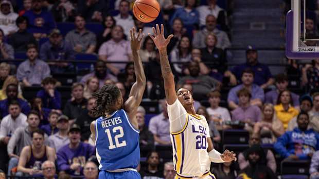 Feb 21, 2024; Baton Rouge, Louisiana, USA; Kentucky Wildcats guard Antonio Reeves (12) shoots a jump shot over LSU Tigers forward Derek Fountain (20) during the first half of the game at Pete Maravich Assembly Center. Mandatory Credit: Stephen Lew-USA TODAY Sports