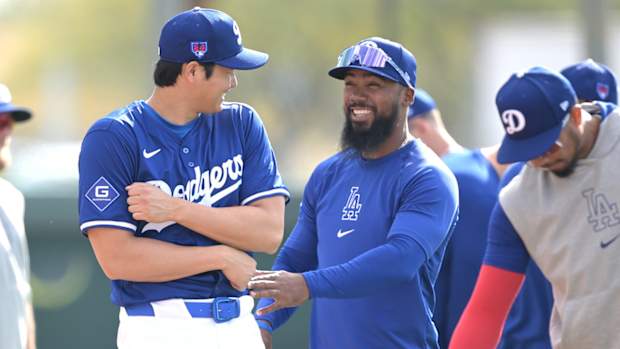 Shohei Ohtani laughts with Teoscar Hernandez during spring training.
