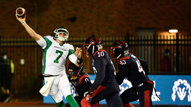 Oct 30, 2021; Montreal, Quebec, CAN; Saskatchewan Roughriders quarterback Cody Fajardo (7) passes the ball against Montreal Alouettes defensive lineman Nick Usher (10) in the first quarter during a Canadian Football League game at Molson Field. Mandatory Credit: Eric Bolte-USA TODAY Sports  
