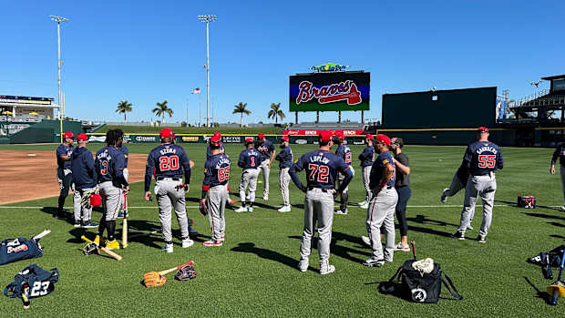 Atlanta Braves gather on the field before starting their spring training workout on Tuesday, Feb. 20, 2024 at CoolToday Park in North Port, Florida.  
