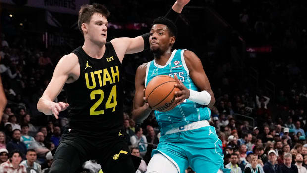 Jan 27, 2024; Charlotte, North Carolina, USA; Charlotte Hornets forward Brandon Miller (24) drives to the basket against Utah Jazz center Walker Kessler (24) during the second quarter at Spectrum Center. Mandatory Credit: Jim Dedmon-USA TODAY Sports