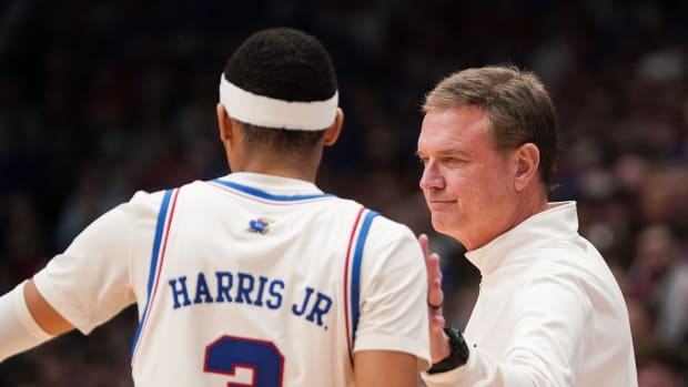 Feb 24, 2024; Lawrence, Kansas, USA; Kansas Jayhawks head coach Bill Self talks with guard Dajuan Harris Jr. (3) against the Texas Longhorns during the first half at Allen Fieldhouse. Mandatory Credit: Denny Medley-USA TODAY Sports  
