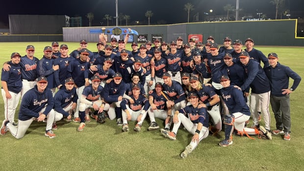 The Virginia baseball team celebrates after defeating Auburn to win the inaugural Jax College Baseball Classic.