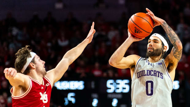 Northwestern Wildcats guard Boo Buie (0) shoots the ball against Nebraska Cornhuskers guard Sam Hoiberg (1) during the second half at Pinnacle Bank Arena.