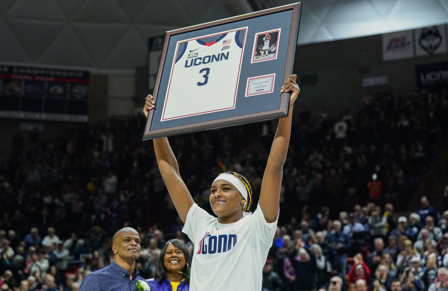Feb 16, 2024; Storrs, Connecticut, USA; UConn Huskies forward Aaliyah Edwards (3) holds up her jersey during senior night after defeating the Georgetown Hoyas at Harry A. Gampel Pavilion. 