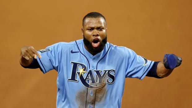 Oct 25, 2020; Arlington, Texas, USA; Tampa Bay Rays left fielder Manuel Margot (13) reacts after reaching third base after Los Angeles Dodgers second baseman Chris Taylor (not pictured) committed a catching error during the fourth inning during game five of the 2020 World Series at Globe Life Field.