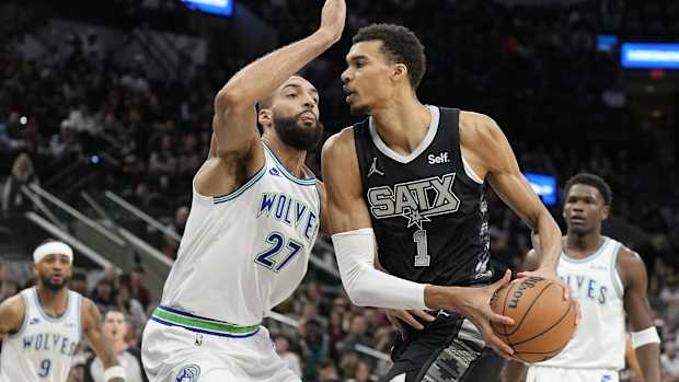 Jan 27, 2024; San Antonio, Texas, USA; San Antonio Spurs forward Victor Wembanyama (1) drives to the basket against the Minnesota Timberwolves center Rudy Gobert (27) during the first half at Frost Bank Center.