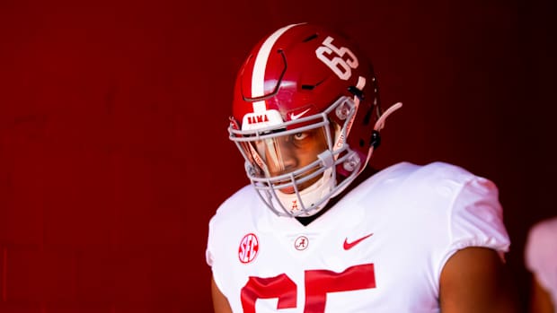 Alabama Crimson Tide defensive lineman JC Latham (65) against the Florida Gators at Ben Hill Griffin Stadium.