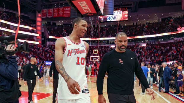 Feb 23, 2024; Houston, Texas, USA; Houston Rockets forward Jabari Smith Jr. (10) and head coach Ime Udoka walk off the court after the game against the Phoenix Suns at Toyota Center. Mandatory Credit: Troy Taormina-USA TODAY Sports