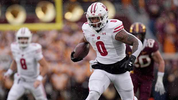 Wisconsin running back Braelon Allen (0) runs for a first down during the second quarter of their game Saturday, November 25, 2023 at Huntington Bank Stadium in Minneapolis, Minnesota. Wisconsin beat Minnesota 28-14.