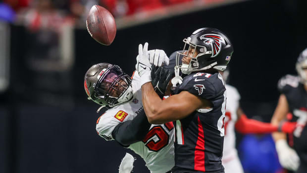 Dec 10, 2023; Atlanta, Georgia, USA; Tampa Bay Buccaneers linebacker Lavonte David (54) breaks up a pass intended for Atlanta Falcons tight end Jonnu Smith (81) in the second half at Mercedes-Benz Stadium. Mandatory Credit: Brett Davis-USA TODAY Sports