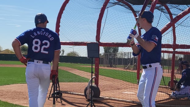 Texas Rangers top prospects Evan Carter, right, and Wyatt Langford, left, both made nice throws from the outfield in the club's 10-3 Cactus League win over the Arizona Diamondbacks Tuesday at Salt River Fields in Scottsdale, Ariz. Langford, the No. 4 overall pick in the MLB draft in July, collected his first spring hit, a 103.5 mph single to left in the sixth inning.
