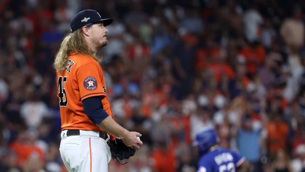 Oct 22, 2023; Houston, Texas, USA; Houston Astros relief pitcher Ryne Stanek (45) reacts after giving up a grand slam against Texas Rangers right fielder Adolis Garcia (53) in the ninth inning during game six of the ALCS for the 2023 MLB playoffs at Minute Maid Park. Mandatory Credit: Troy Taormina-USA TODAY Sports