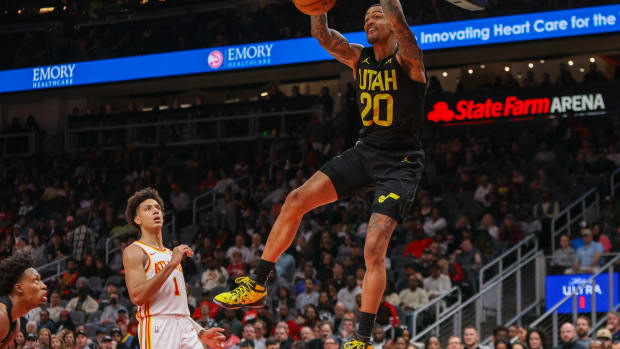 Feb 27, 2024; Atlanta, Georgia, USA; Utah Jazz forward John Collins (20) dunks against the Atlanta Hawks in the second half at State Farm Arena.
