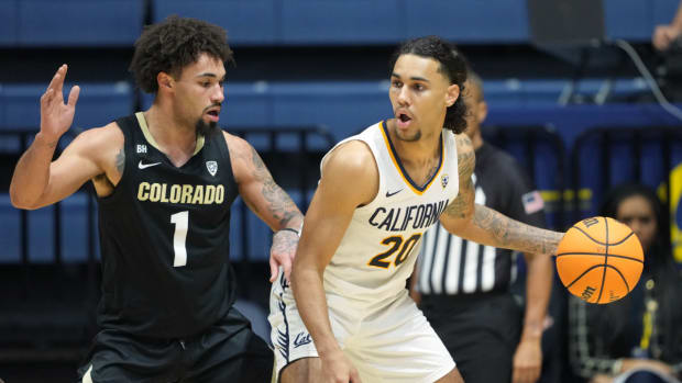 California Golden Bears guard Jaylon Tyson (20) dribbles against Colorado Buffaloes guard J'Vonne Hadley (1) during the first half at Haas Pavilion