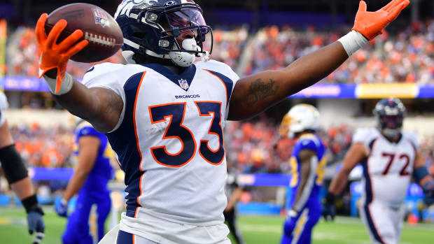 Dec 10, 2023; Inglewood, California, USA; Denver Broncos running back Javonte Williams (33) celebrates his touchdown scored against the against the Los Angeles Chargers during the first half at SoFi Stadium. Mandatory Credit: Gary A. Vasquez-USA TODAY Sports