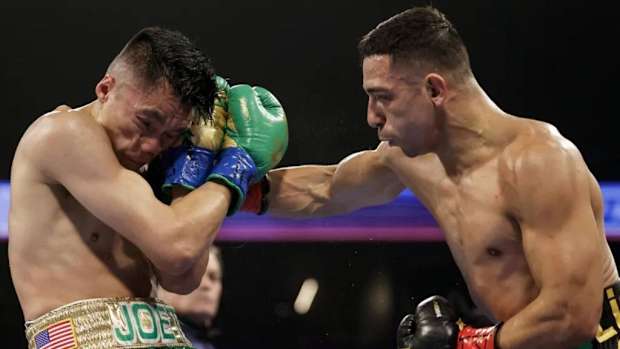Luis Alberto Lopez punches Joet Gonzalez during their IBF featherweight world title fight at American Bank Center in Texas. Lopez will square off against Reiya Abe at Turning Stone Resort Casino in Verona, New York, on Saturday, March 2. CARMEN MANDATO/GETTY IMAGES.